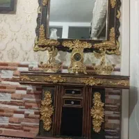 اینه کنسول بادوتاشمعدونی وساعت طلایی