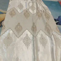 والان دو طرف پرده کرم رنگ در حد نو