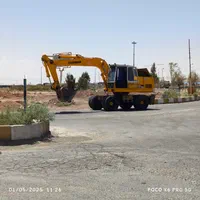 بیل مکانیکی لاستیکی پیکور و تخریب ساختمان