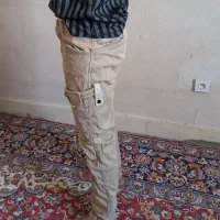 شلوار شیش جیب کرمی