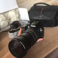 دوربین نیکونD3100 به همراه دوعدد لنز۵۵-۱۸ و۲۰۰-۱۸