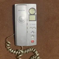 تلفن ثابت رو میزی و شارژر باطری