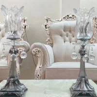 ۴ جفت شمعدان برنجی و یک عدد ساعت دیواری