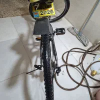 دوچرخه ۲۶ تمیز فنری و کمک دار و دنده ای و پلاک