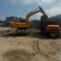 راننده بیل میکانیکی و کامیون