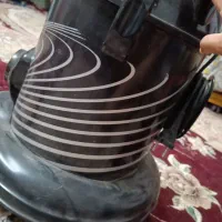 جارو برقی . اجاق گاز . ساعت . تلویزیون