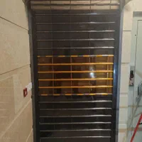 کرکره برقی پلی کربنات و فولادی درب واحد محافظ