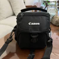 دوربین عکاسی canon به همراه سه پایه benro