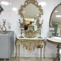 آینه کنسول با شمعدان لاله و ساعت رنگ طلایی