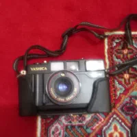 دوربین یاشیکا همراه با جعبه و کیف مخصوص