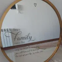 آیینه با قاب فلزی طلایی