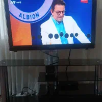فروش تلویزیون به همراه میز و بخاری شومینه ای