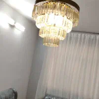 یک جفت لوستر چشمه نور کریستال