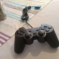 دسته PS2 بسیار تمیز و سالم  با ویبره تخفیف دارد