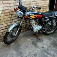 یک عدد موتور با انجین 150خشک پلم