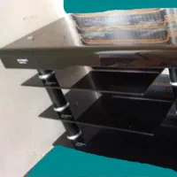 زیر تلویزیونی شیشه ای دودی شیک و تمیز