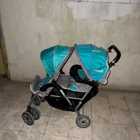 فروش کالسکه دوقلو خارجی فیروزه‌ای و طوسی