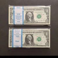 4عدد 100دلاری و 3بسته صد تایی یک دلاری