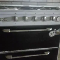 تلویزیون با میز قالی دوعدد اجاق گاز