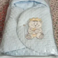 یک عدد کفش پاشنه بلندوکیسه خواب نوزاد
