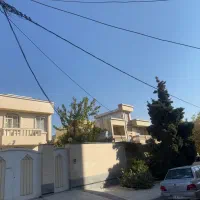 زمین ۲۰۰ متری درب حیاط عرض ۱۰ شهرک گلها