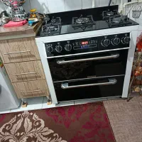 اجاق گاز  شیشه ای طرح فر کاملا سالم در حد نو