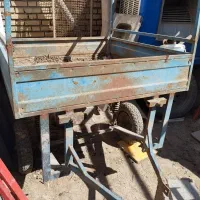 گاری سه چرخه ای پشت موتور بسته میشه