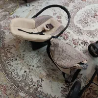 کالسکه و کریر و روروئک و ساک بچه کرم قهوه ای|کالسکه و لوازم جانبی|رباط‌کریم, مسکن مهر آبشناسان|دیوار
