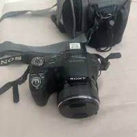 دوربین سونی sony hx100v فوق‌کم کار باکیف و سه پایه