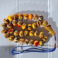 تسبیح کهربای پرچمی دستساز استاد نظیر بوکان ۱۰۵ گرم
