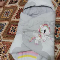 اغوشگیر و تشک نوزاد