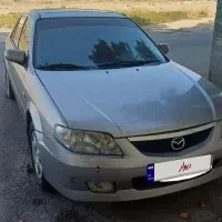 مزدا سواری323مدل1384flسانروف دار اتاق وفنی سالم