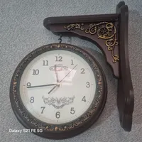 ساعت دیواری دو طرفه و پرده