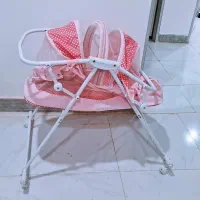 گهواره چرخ دار بچگونه