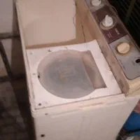 یک عدد ماشین لباس شویی