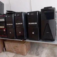 تعدادی کیس و 2 عدد مانیتور  و کیبورد اداری