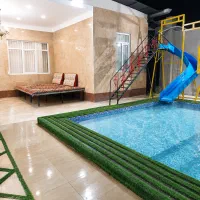 استخر روباز آبگرم با سرسره آبی در خوشنام