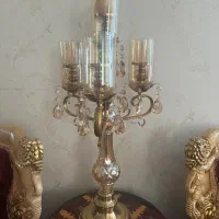 شمعدانی چهار شاخه و تلفن