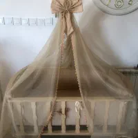 گهواره کنار تخت مادر