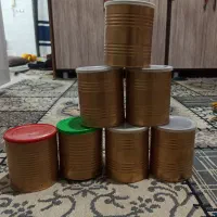 قوطی رنگ شده شیرخشک و قوطی رنگ نشده