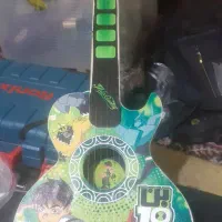 مقداری وسایل اسباب بازی گیتار  موتور ۷۰ و ۱۲۵