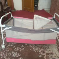 لباس بچه و گهواره و روروک