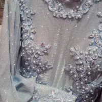 لباس مجلسی بلند آبی یخی سنگ‌دوزی شده