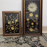 ساعت به همراه قاب طرح گل طلایی