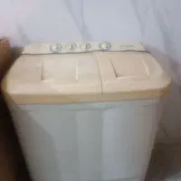 یک عدد ماشین لباس شویی