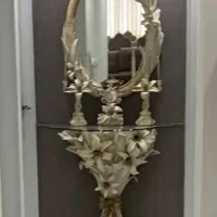 ساعت ایستاده و اینه شمعدون و ساعتش