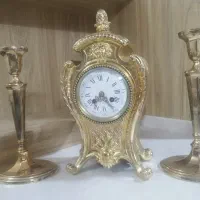 ساعت قدیمی و آنتیک با شمع دان