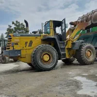 خاکبردای و خاکریزی لودر و کامیون