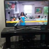 فروش تلویزیون 42 اینچ با میز شیشه ای