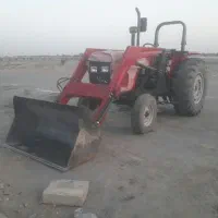 تراکتور بیل لودری با تریلی جهت کار.